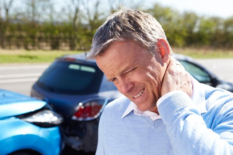 Person experiencing TMJ pain after an auto injury