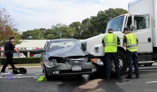 Semi-truck collision scene on highway