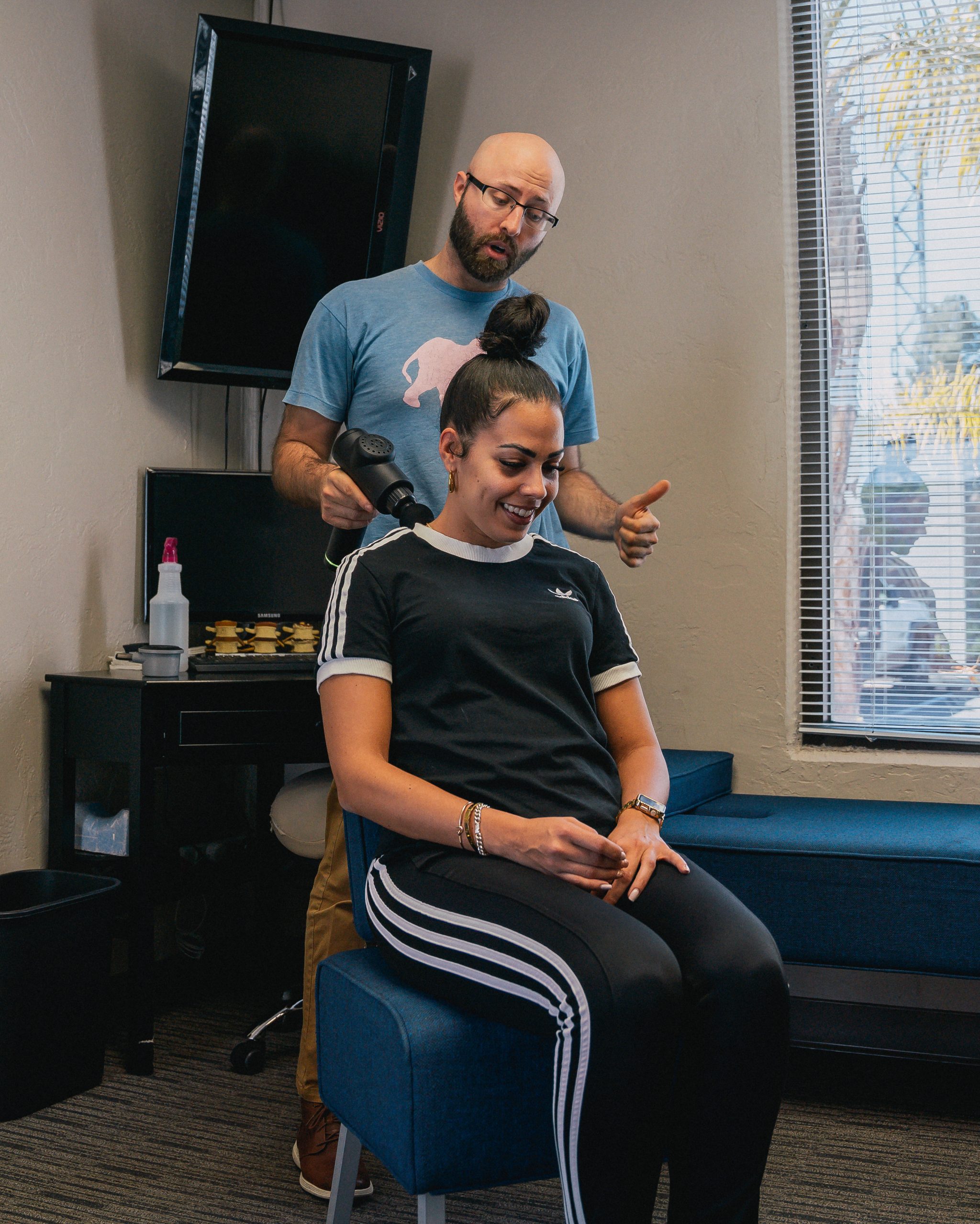 Dr. Zachary Beatty volunteering at community outreach events.