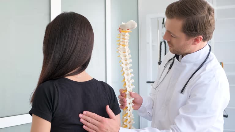 Chiropractor assessing patient after crosswalk accident